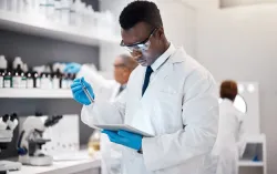 Technician in lab with tablet for medical analysis and digital innovation