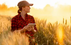 Women with tablet in outdoor field