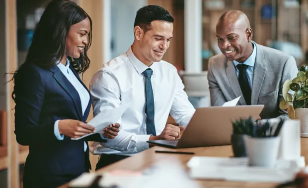 Diverse group of smiling businesspeople working in an office