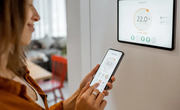 Woman looking at a smart meter