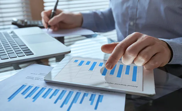 Businessman working with financial report charts