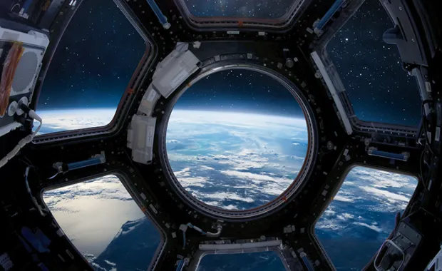 Earth through the International space station porthole.