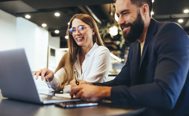 Cheerful businesspeople using ERP
