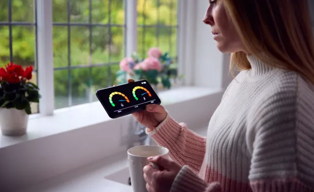 woman looking at a smart meter