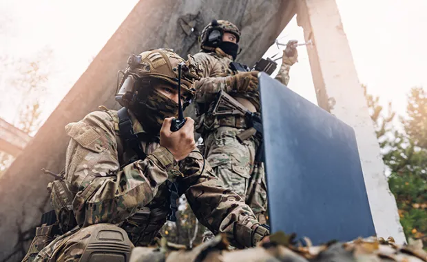 oldier engineer transmits aerial pictures and data from drone to artillery