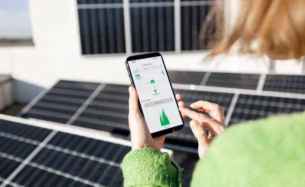 Woman monitoring energy production