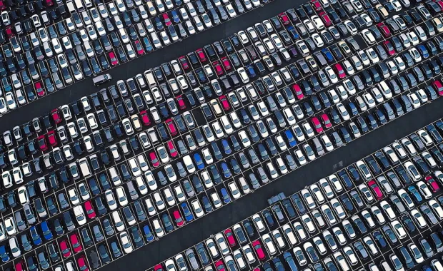 Aerial view of a large parking lot full of cars