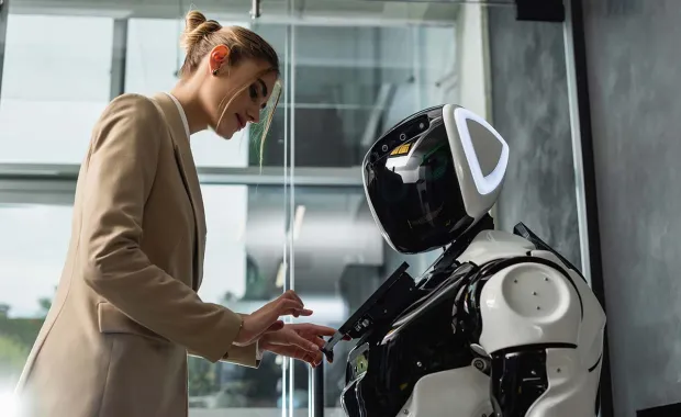 person interacting with AI robot