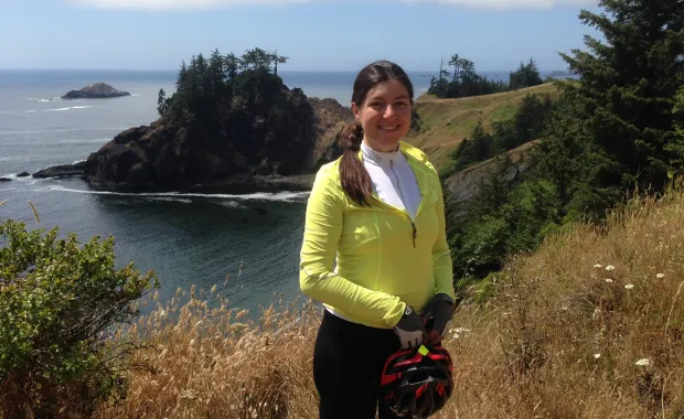 Becca Sanchez of CGI standing on the Pacific coast