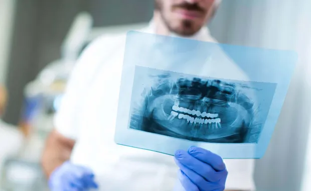 Dentist holding Xray