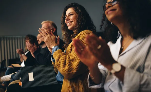 business_professionals_applauding_at_conneXion event