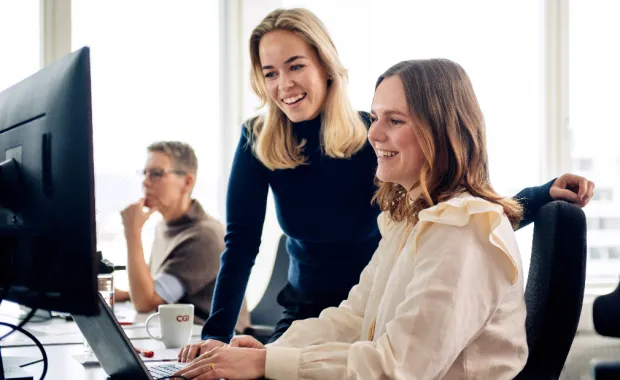 Two business women using computer