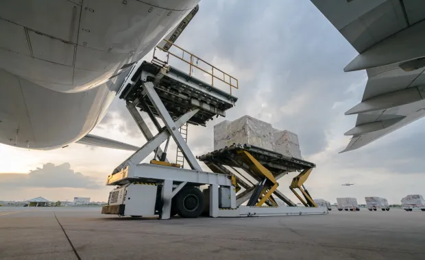 Cargo pallets being loaded into a large aircraft