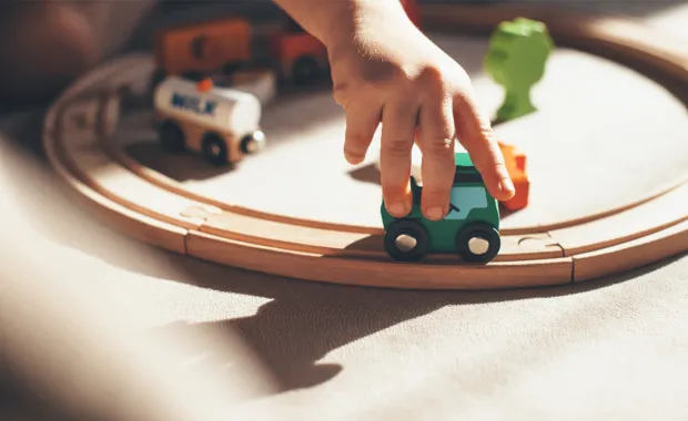 child playing with trains