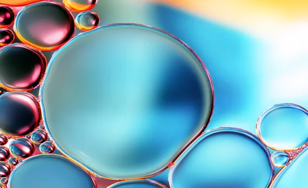 Close up of water droplets in blue and red light