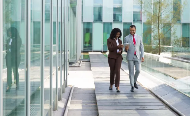 Colleagues walking and discussing privacy
