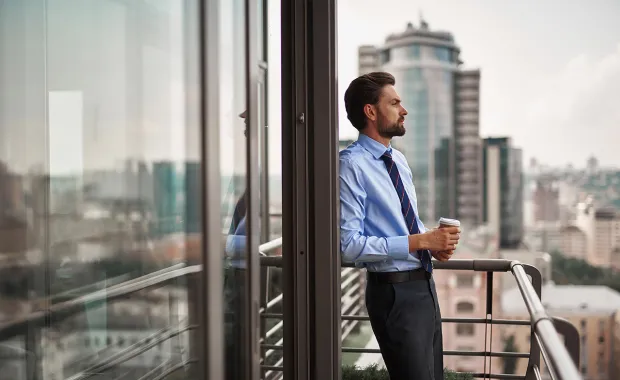consultant standing on office balcony