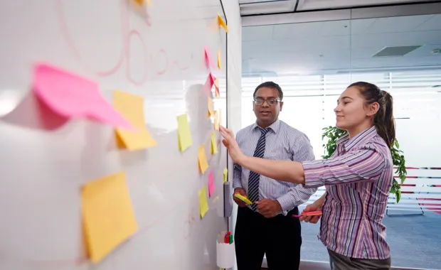 Consultants engage in a brainstorm