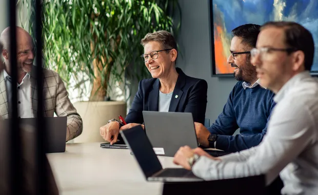 Cyber consultants sat around desk