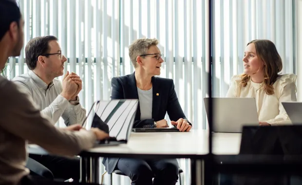 Cyber consultants sat around desk