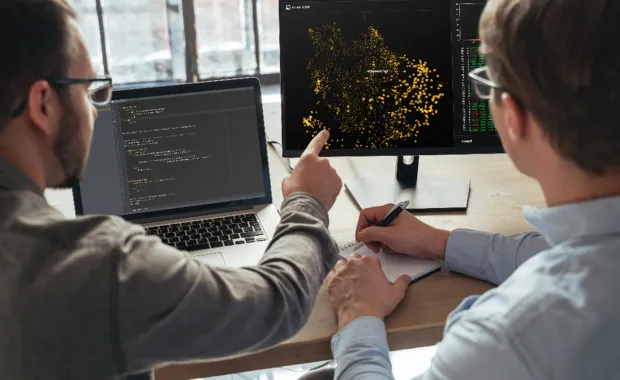 Cyber security consultant points at screen