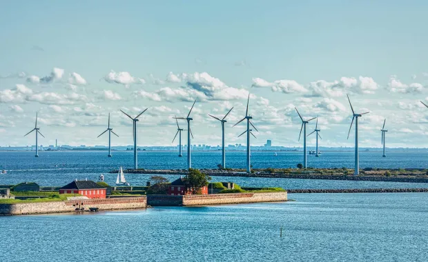 Danish Scandinavian wind farm in Copenhagen surrounded by water