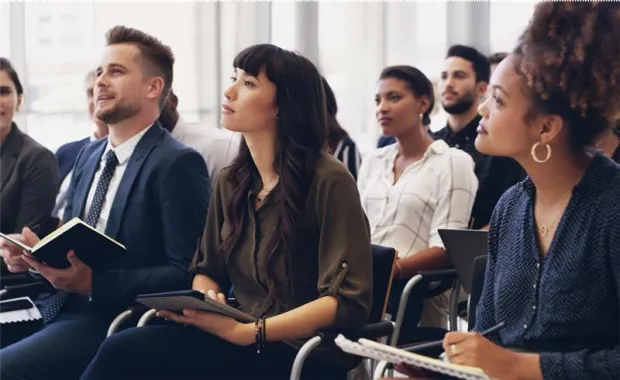 group of people listening at an event