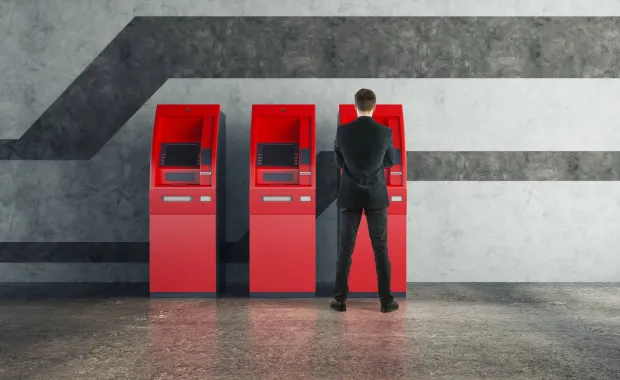 Man taking money at an ATM