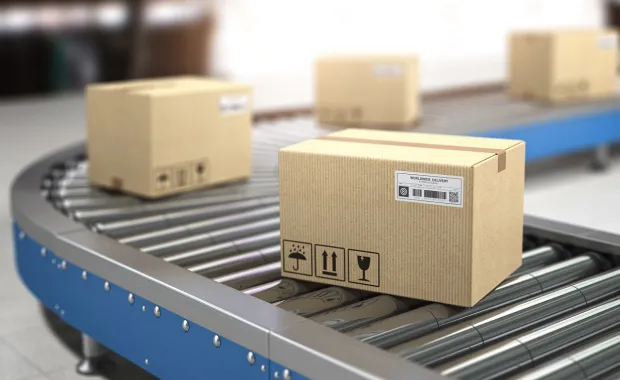 retail packages on a supply chain conveyer belt
