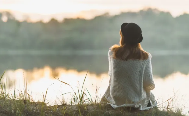 person by the river