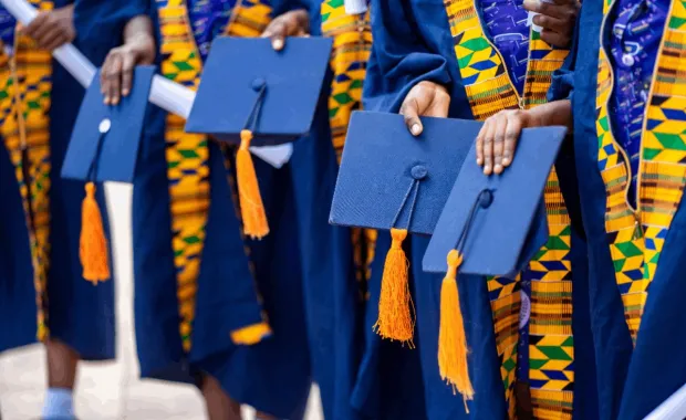 Graduates wearing dark blue gowns