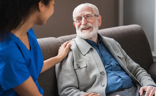 health care professional caring for elderly patient