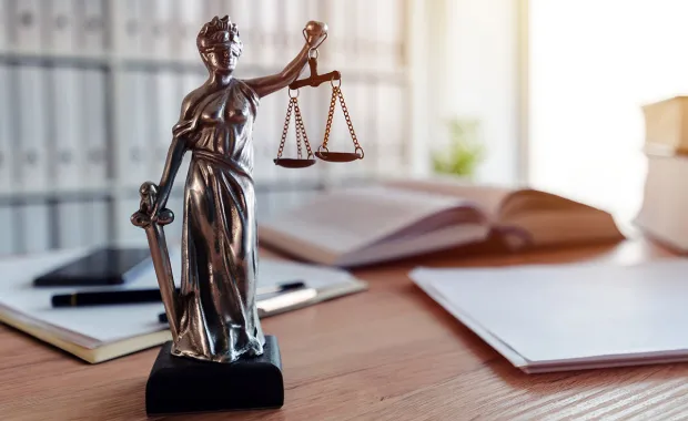 Justice statue sitting on desk