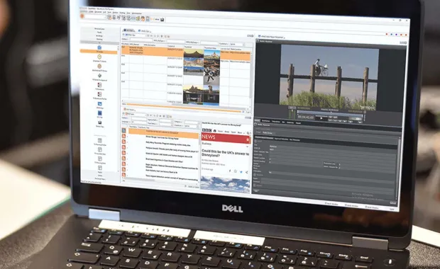 Laptop showing an editing screen for a news show