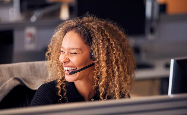 Woman answering phone in call centre
