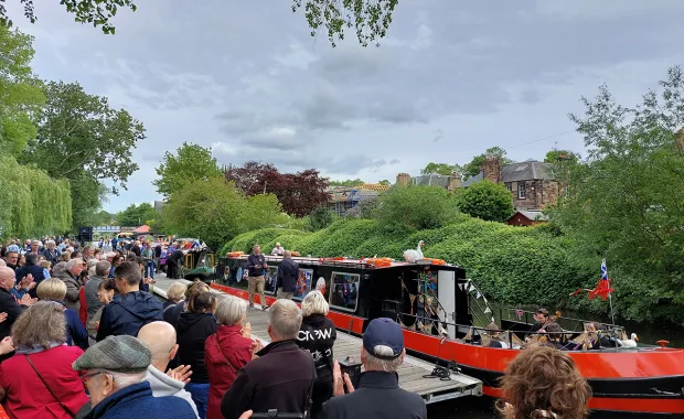 crowd of people around canal boat on the Union Canal