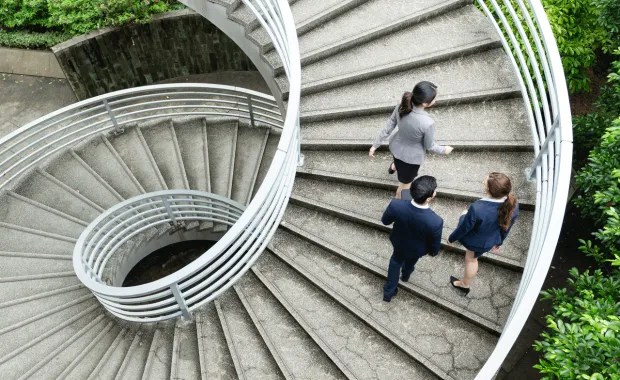 Consultants on a large modern spiral staircase