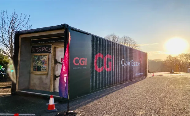 CGI Cyber Escape Experience container at sunset