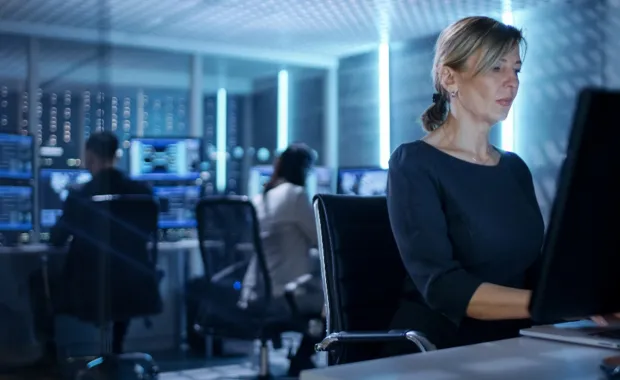 Female worker in mission control room 