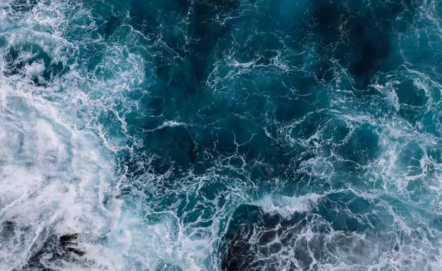 Aerial shot of crashing waves
