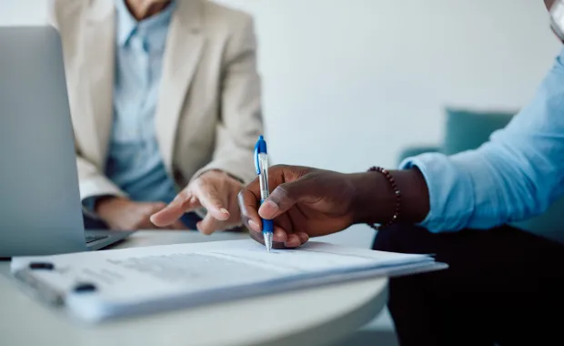 person signing an insurance contract