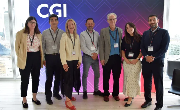 People pose for photo at CGI empowering inclusion event