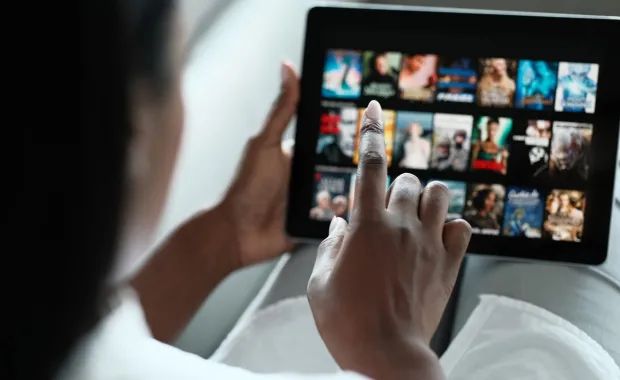 Person scrolling through tablet screen