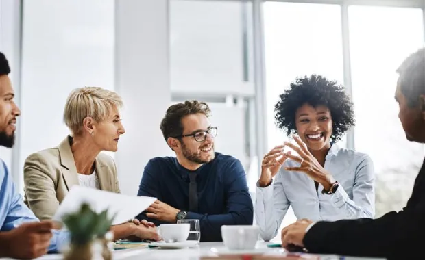 Professionals meeting around desk