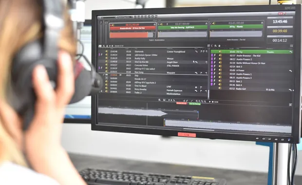 radio broadcaster viewing dira radio solution on monnitor