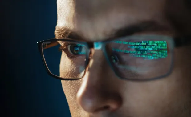 Reflection of code in glasses