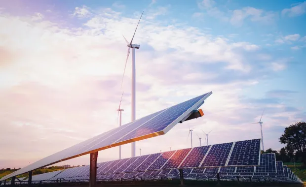 Energy farm with solar panels and wind turbines  
