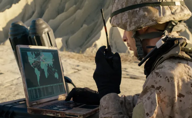 Marine using ruggedized laptop