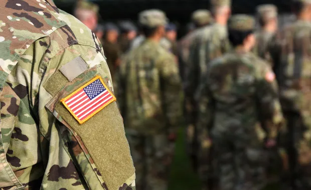 soldier standing with American flag patch