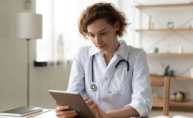 Female doctor working on an i-pad